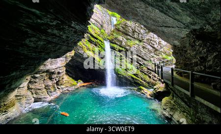 A spectacular view from inside a cave at the Thur waterfalls (Thurwasserfälle) in the Säntis massif, Switzerland. Stock Photo