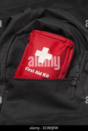First Aid Kit on a black backpack Stock Photo