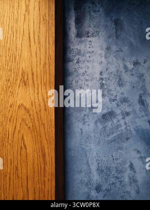 Wall with warm wooden trim and grunge blue background. Stock Photo