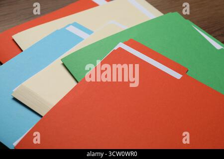 Many documents in folders on wooden table, closeup Stock Photo