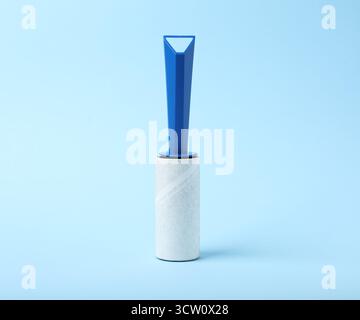 One lint roller on light blue background Stock Photo