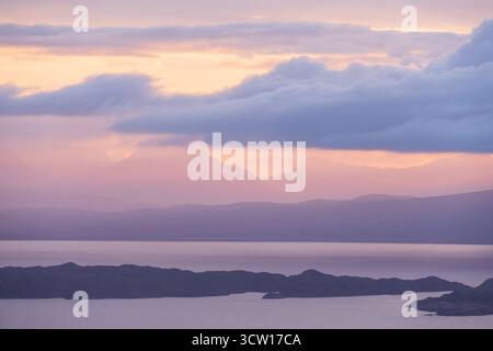 Colourful dawn sky across Rona and the Sound of Raasay looking towards the Torridon Hills, Scotland.  Winter (February) 2025. Stock Photo