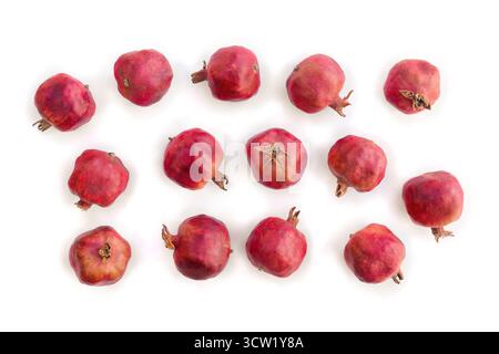 Fresh red pomegranate garnets on white background. Top view, flat lay Stock Photo