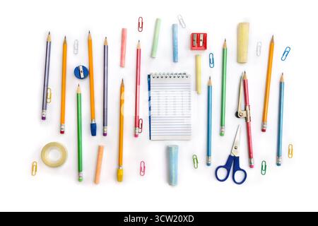 Back to School. School supplies ( notebook, pencil, scissors, sharpener, clips, crayons ) on a white background. Top view, flat lay Stock Photo