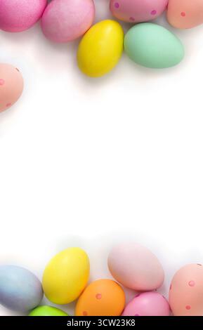 Easter decoration. Easter colorful eggs on a white background with space for text. Top view, flat lay Stock Photo