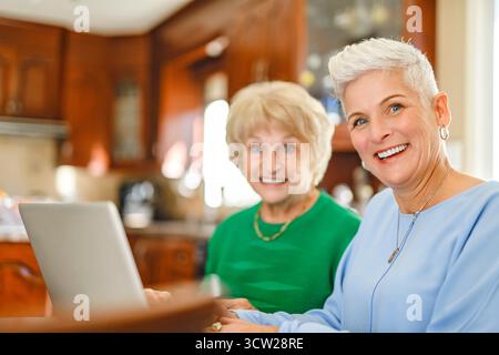 A daughter explaining some documentation to senior parent Stock Photo