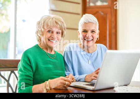 A daughter explaining some documentation to senior parent Stock Photo