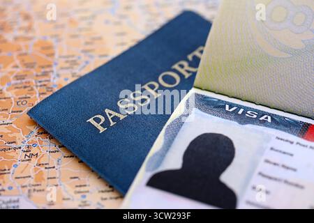 USA visa background. US visa in passport on United States geographical map close up. Immigration and travel concept Stock Photo