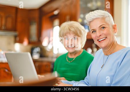 daughter explaining some documentation to senior parent Stock Photo