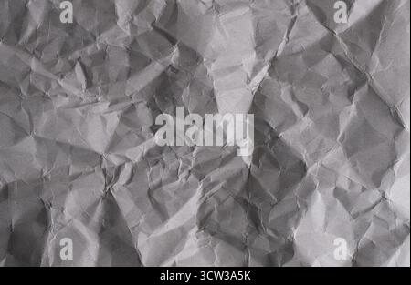 Crumpled grey paper background. Crumpled paper texture Stock Photo