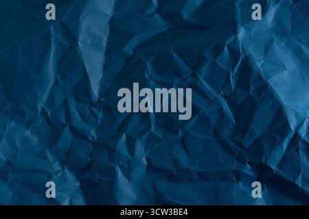 Crumpled blue paper background. Texture of crumpled paper Stock Photo