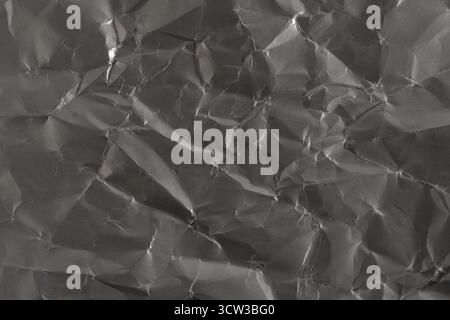 Grey crumpled paper texture. Abstract background and texture for design Stock Photo