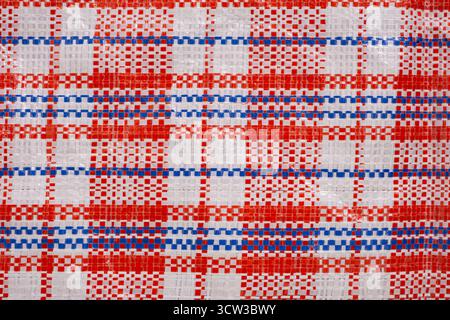 Red and blue checkered fabric as background, close up Stock Photo