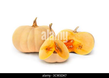 Fresh whole, half and sliced pumpkins on a white background with space for text Stock Photo