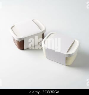 White ice cream tubs on a white background, seen from above Stock Photo