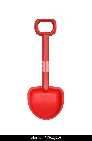 Red children’s plastic toy shovel cut out and isolated on white background Stock Photo