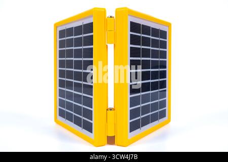 Portable solar panel isolated on white background. Small solar battery cell panel. Mini charging system. Renewable and clean energy concept Stock Photo