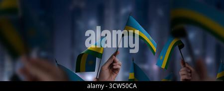 Rwanda flag in hand. Patriotic background. National flag of Rwanda ...