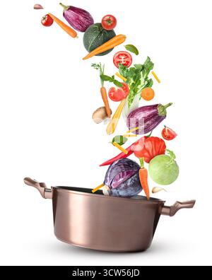 Cooking pot and different flying vegetables on white background Stock Photo