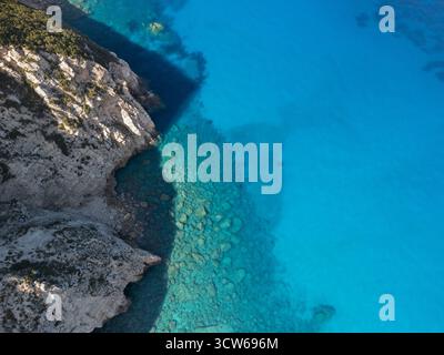 An aerial view of a rocky beach meeting the sea Stock Photo - Alamy