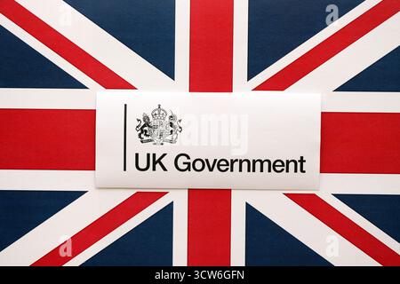 KYIV, UKRAINE - SEPTEMBER 17, 2025 Government GOV UK logotype sticker lies on UK flag close up Stock Photo