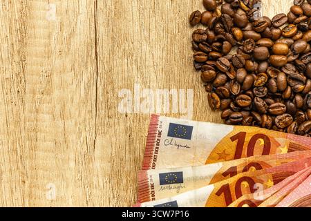 Coffee beans and euro banknotes on financial chart showing rising global coffee prices. Concept of coffee trade, economy, inflation, and market growth Stock Photo