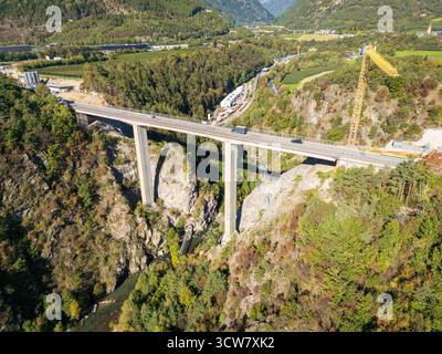 Ponte Riga near Varna and the A22, with the famous Brenner Base Tunnel construction site in the background, merging engineering and Alpine scenery. Stock Photo