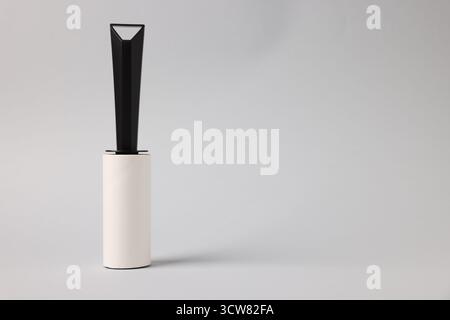 One lint roller on light grey background, space for text Stock Photo