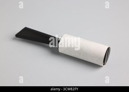 One lint roller on light grey background, closeup Stock Photo
