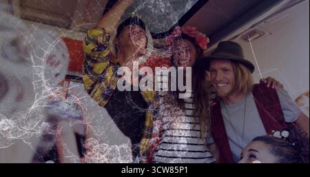 Cheering five travelers standing with arms around other in plane aisle, flower crown and fedora hat. Adventure, camaraderie, celebration, upbeat, trav Stock Photo