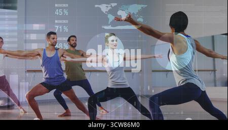 Practicing guided group holding warrior poses in yoga studio, with mats, barre and overlay graphics. Fitness, wellness, mindfulness, exercise, balance Stock Photo