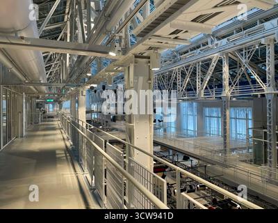 High-Tech Manufacturing Plant Interior with Automated Machinery Stock Photo