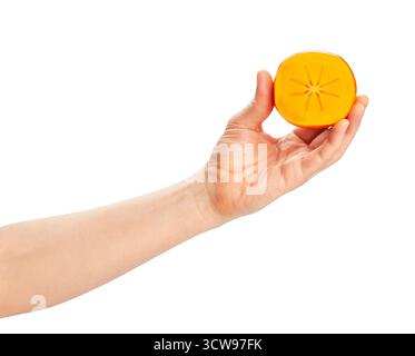 sliced persimmon in hand path isolated on white Stock Photo
