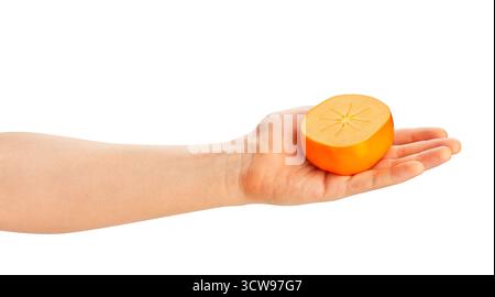 sliced persimmon in hand path isolated on white Stock Photo