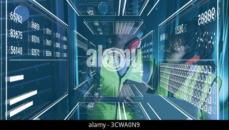 Monitoring two engineers wearing vests and earmuffs in virtual corridor, with holographic panels Stock Photo