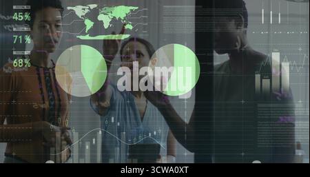 Three female professionals collaborating on glass screen in office in work attire, with data charts Stock Photo