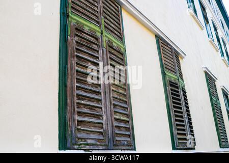 Exterior old wooden window blinds Stock Photo