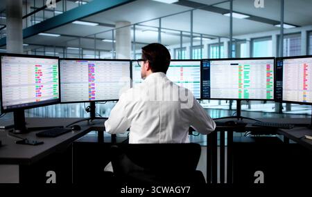 Doctor Updates Hospital Spreadsheet Using Computer Codes For Medical Billing. Stock Photo