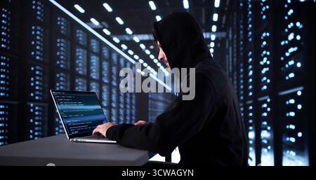 The Suspicious Man Breaking Into A Server Computer Stock Photo