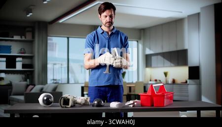 Elderly Technician Installing Surveillance Camera For Building Security And Safety. Stock Photo