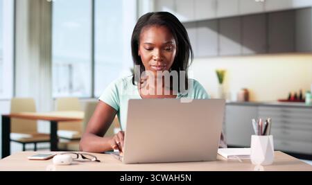 Portrait Of A Black Woman Studying For Legal Analyst Position. Stock Photo