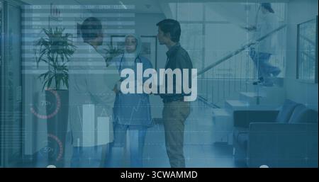 Reviewing doctor, nurse, consultant examining records in hospital lobby, with stethoscope tablet Stock Photo
