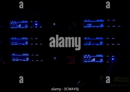 This is a modern dashboard control interface featuring stunning blue lighting accents Stock Photo