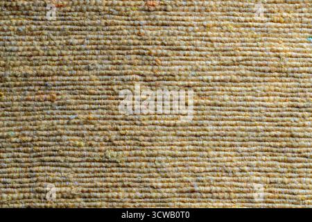 Yellow texture of natural eco fabric, close up . Background of yellow rough fabric Stock Photo