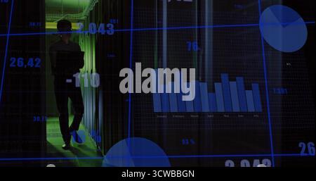 Server tech in dark shirt walking through data center aisle, with status LEDs and digital overlays Stock Photo