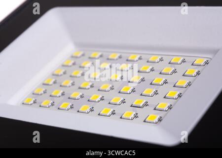 LED spotlight lamp close up. LED diodes background. Waterproof outdoor flood lights, reflector Stock Photo