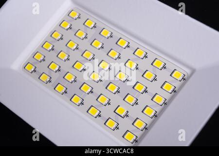 LED spotlight lamp close up. LED diodes background. Waterproof outdoor flood lights, reflector Stock Photo