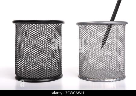Black pen in grey metal vase pen holder isolated on white background. Empty basket paper, waste bin. Cup for pens Stock Photo