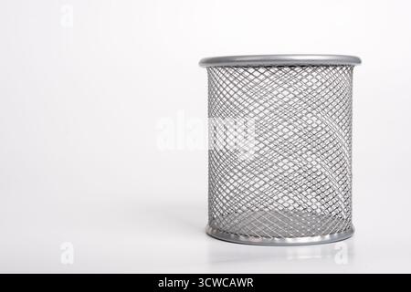 Gray metal pen holder isolated on white background. Empty basket paper, waste bin. Cup for pens, copy space Stock Photo