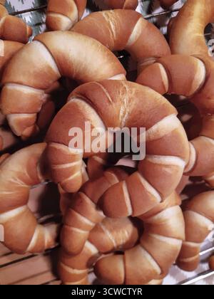 A stack of golden-brown croissants, freshly baked on a tray, Weinviertel Lower Austria Austria Stock Photo